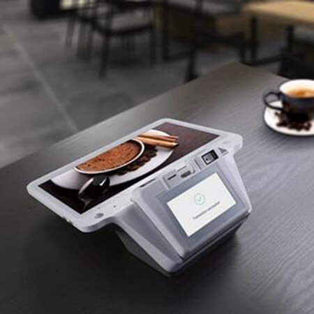 PAX E700 angled view with integrated thermal printer and hybrid card reader