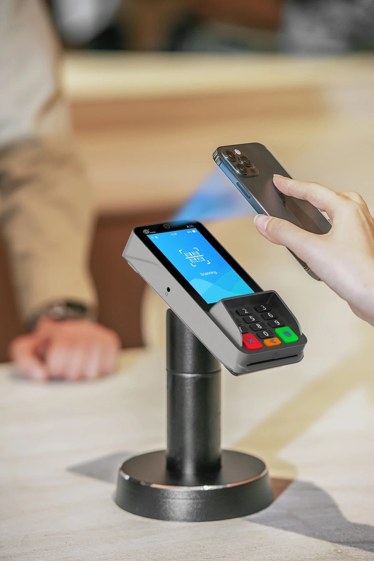 PAX A35 Android PIN pad mounted on pole stand accepting NFC contactless tap from mobile phone